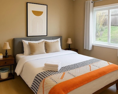 Peaceful 2-bedroom suite with private entrance full kitchen and 1 bath. Enjoy a bright living space smart TV Wi-Fi and access to a tranquil garden